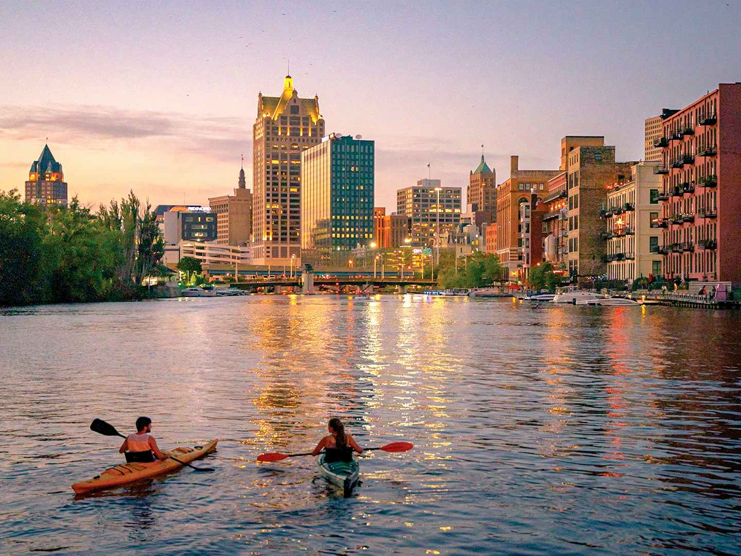 people kayaking on river in downtown milwaukee wisconsin