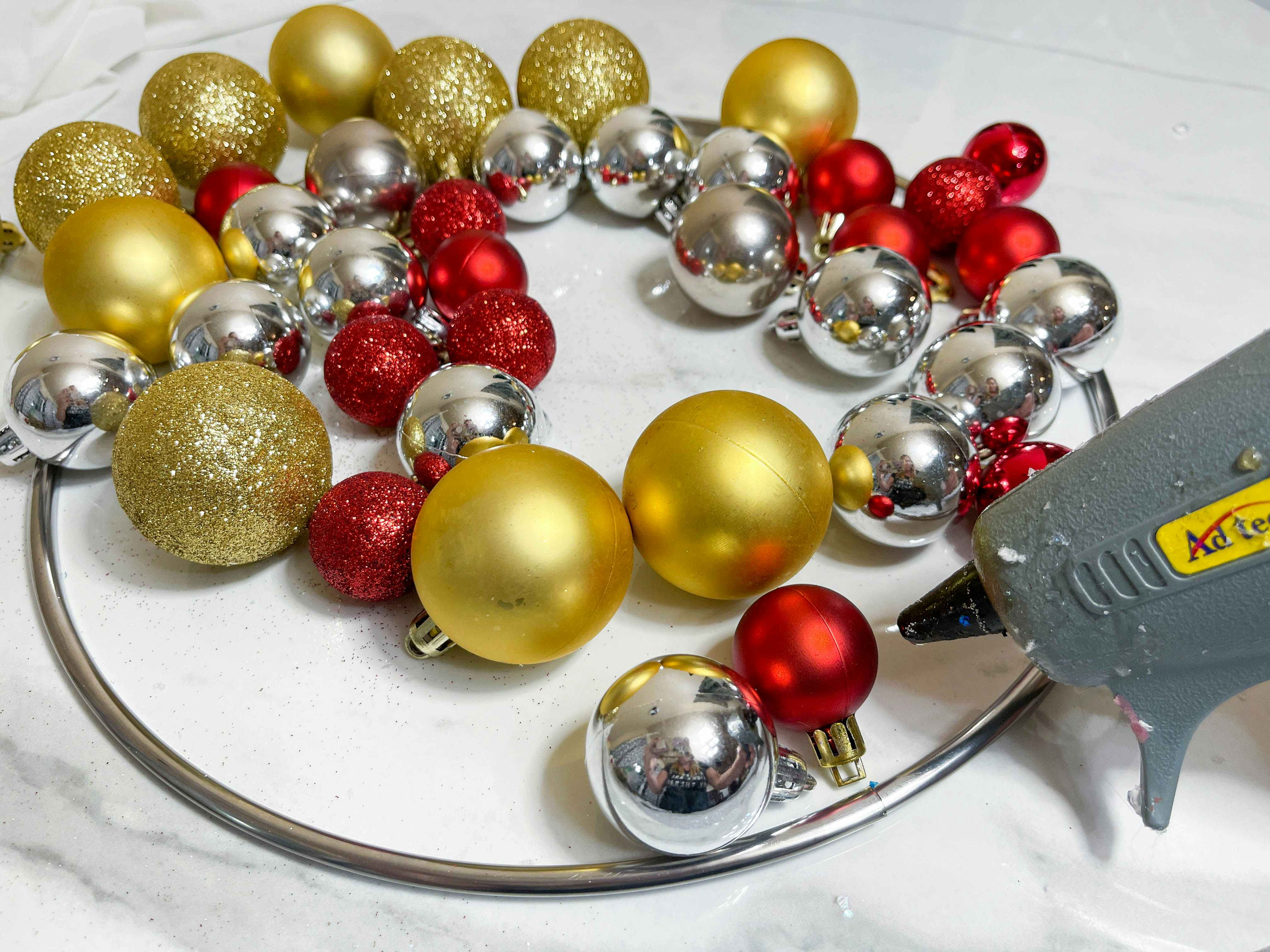 ball ornaments with a glue gun and metal circle 