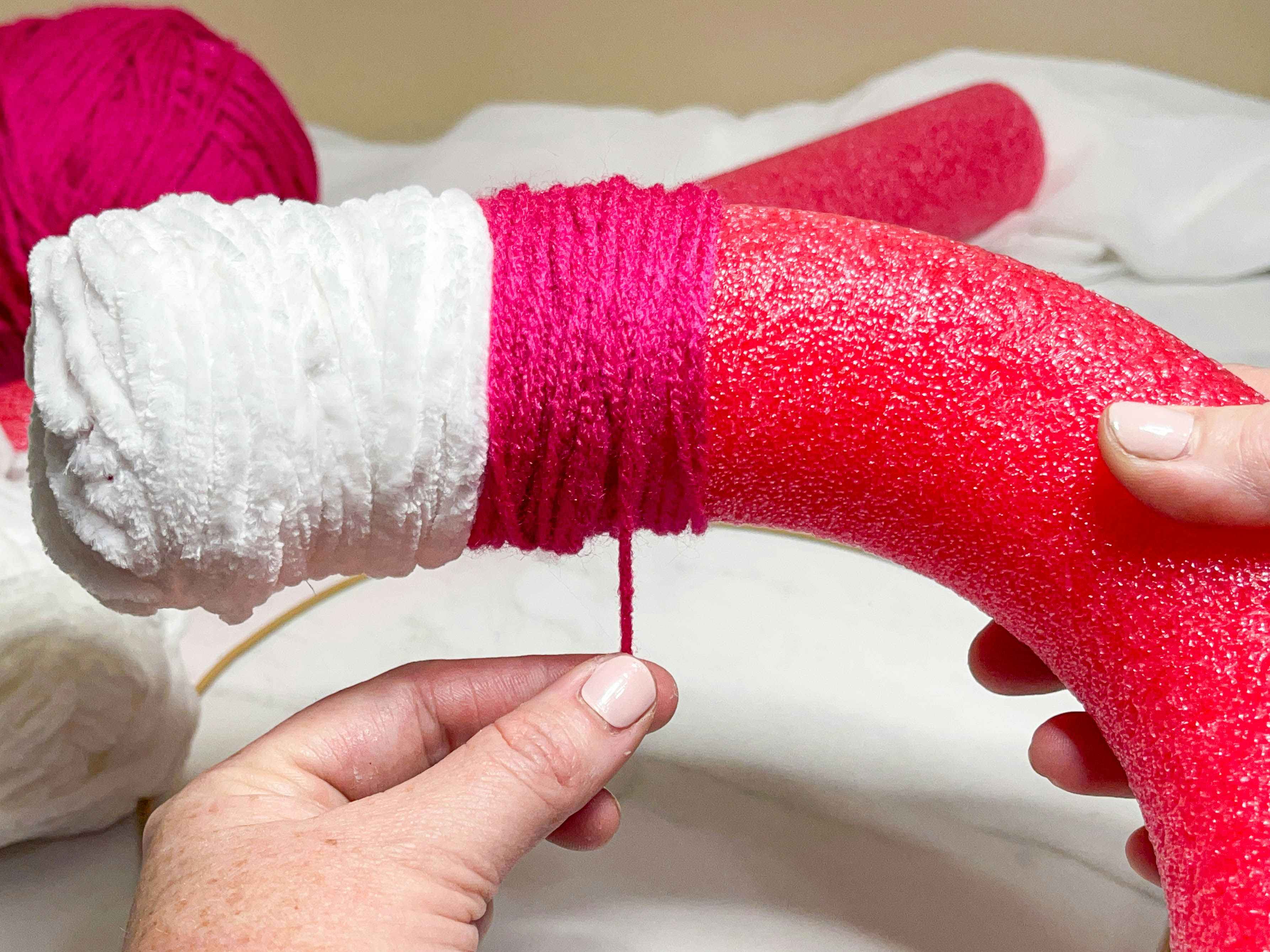 yarn being added to a pool noodle