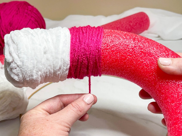 yarn being added to a pool noodle