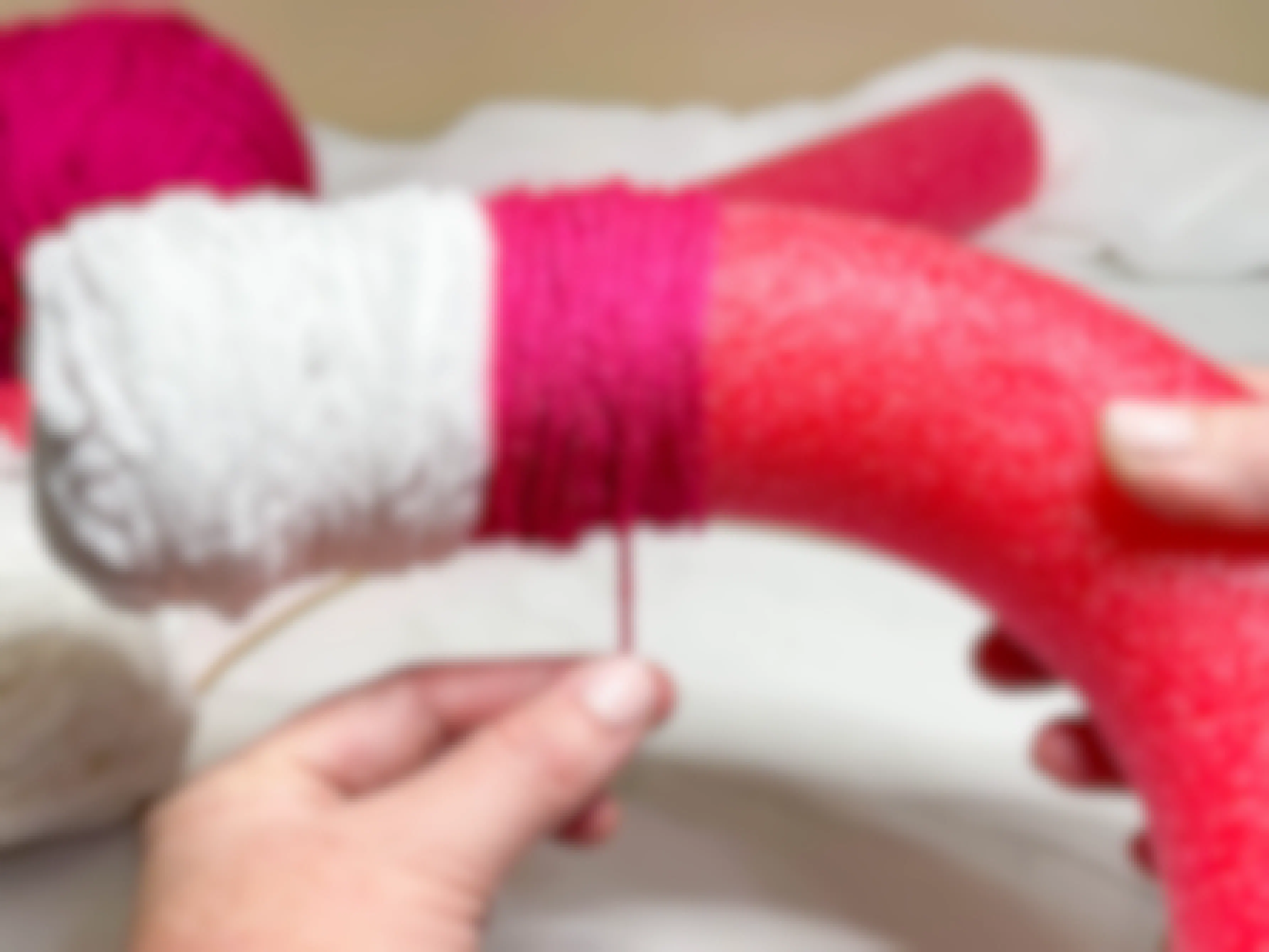 yarn being added to a pool noodle