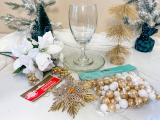 supplies to make a wine glass candle holder on table