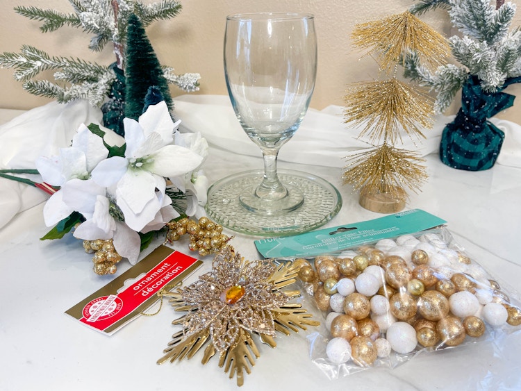 supplies to make a wine glass candle holder on table