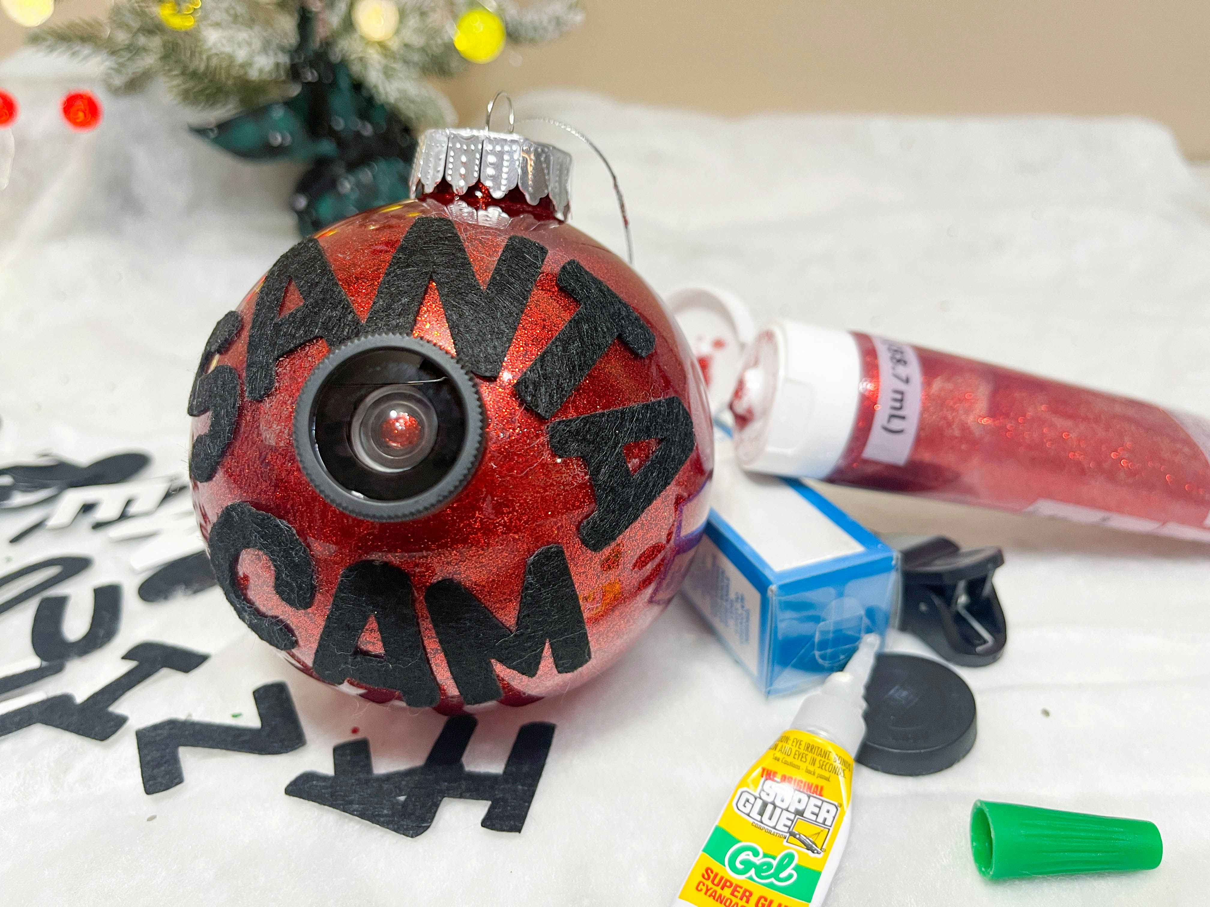 diy santa cam ornament with supplies to make on table