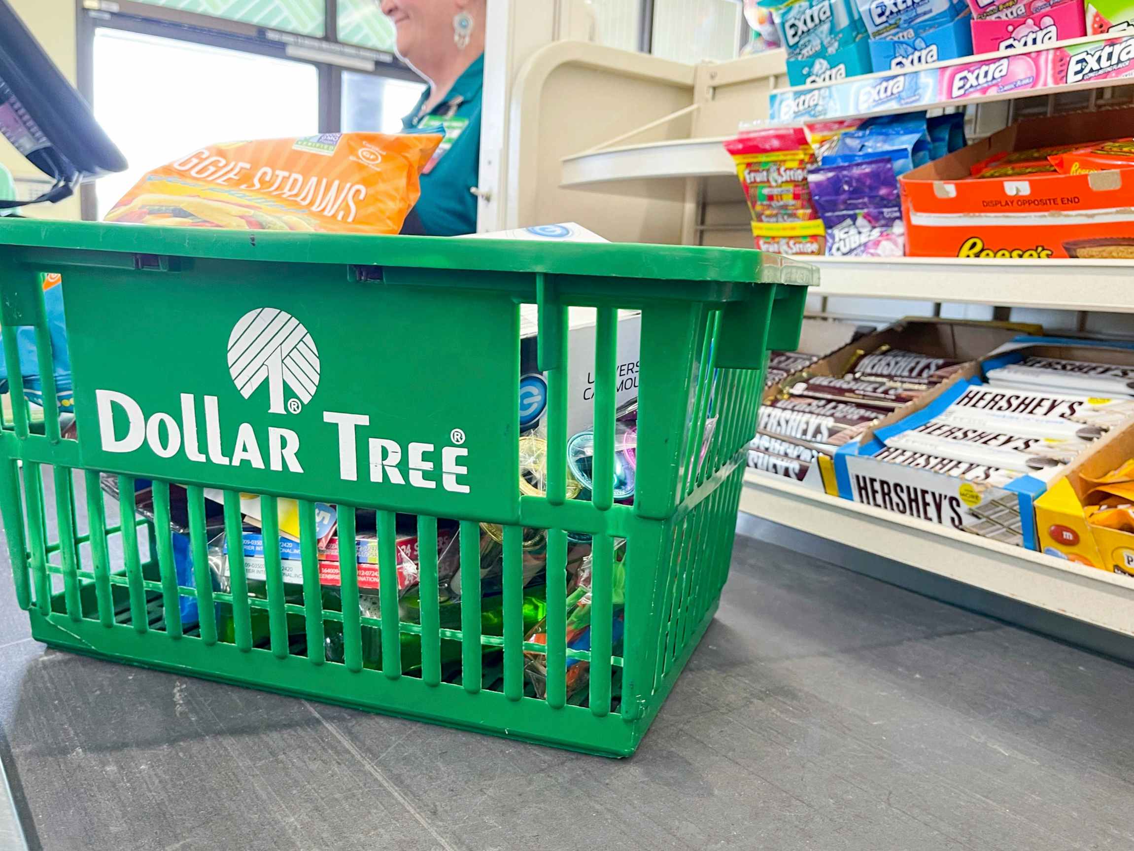 A shopping basket on a checkout conveyer belt at Dollar Tree