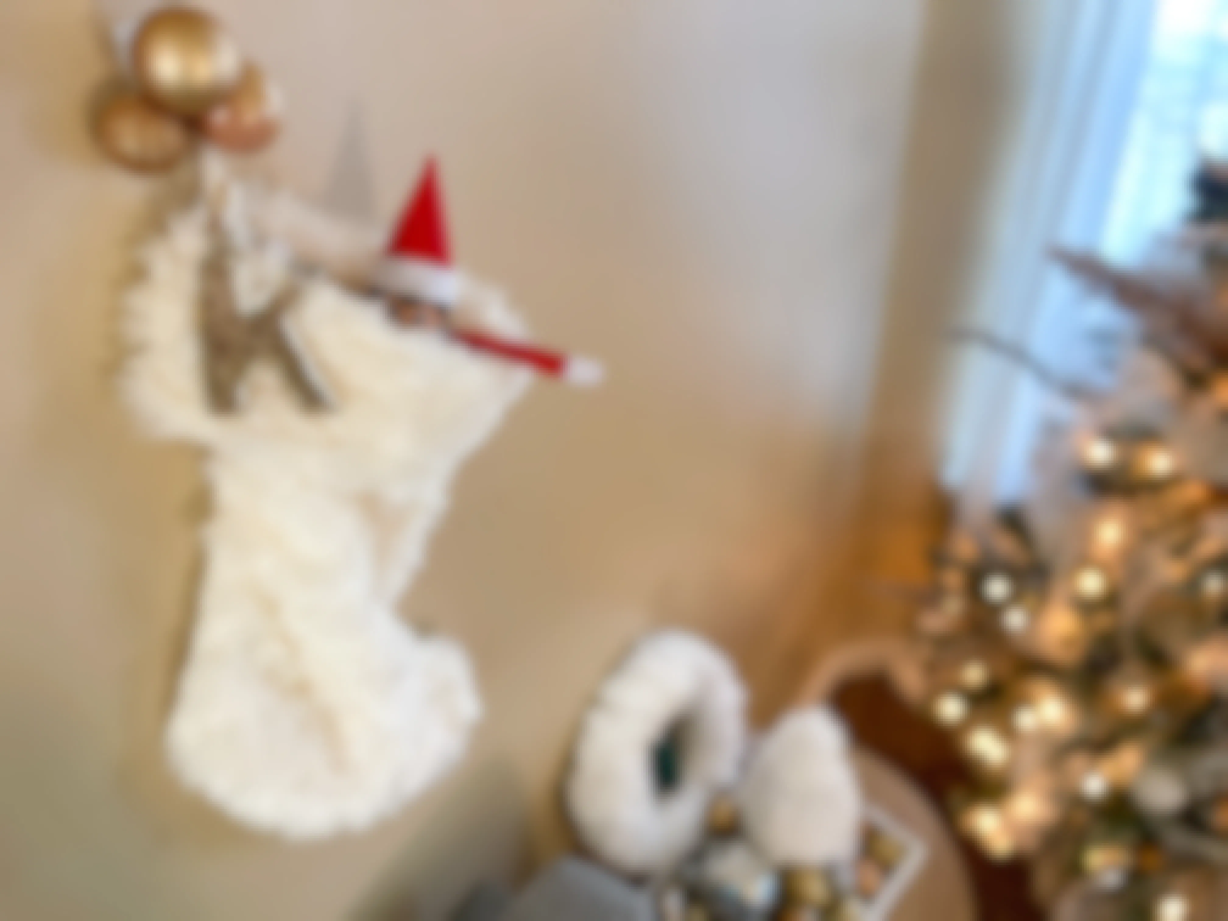 elf on the shelf doll hiding in a stocking 