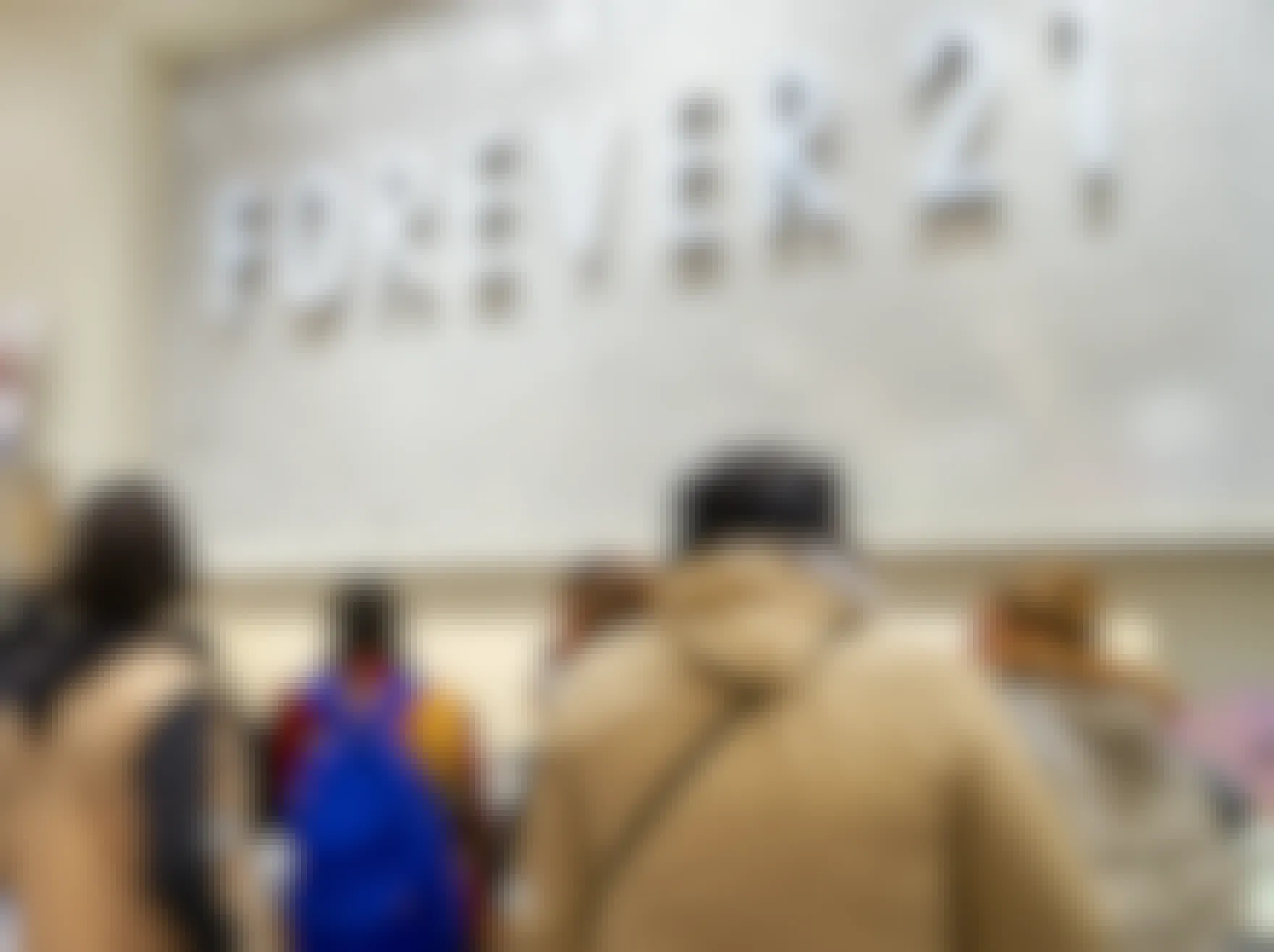 People waiting in line to checkout at a Forever 21 store