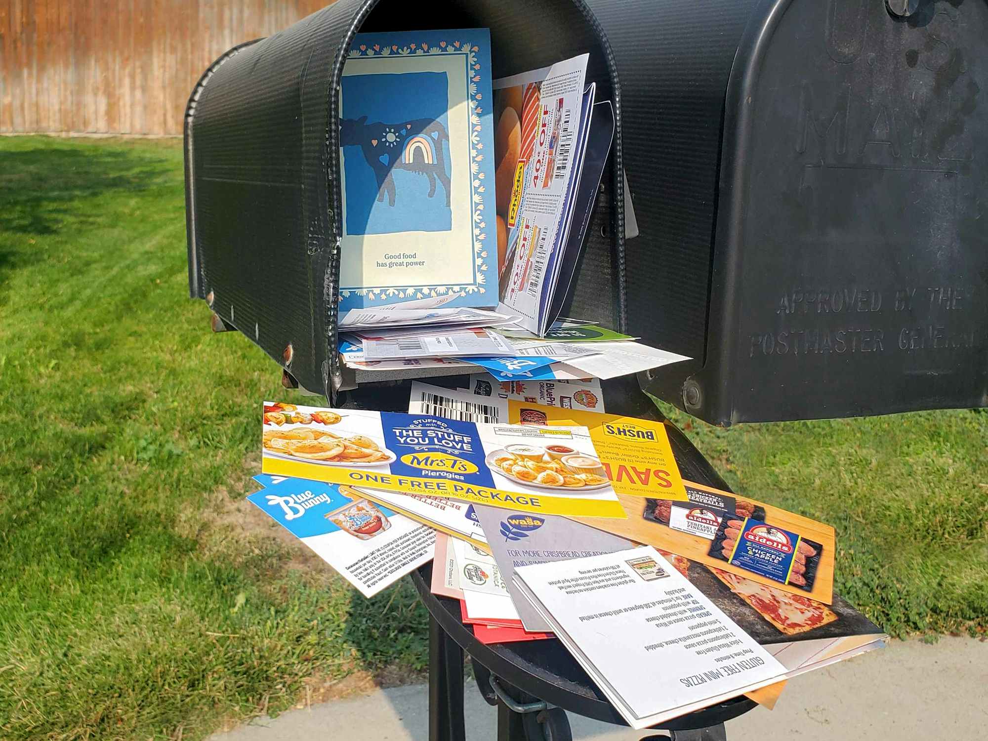 Mailbox overstuffed with coupons