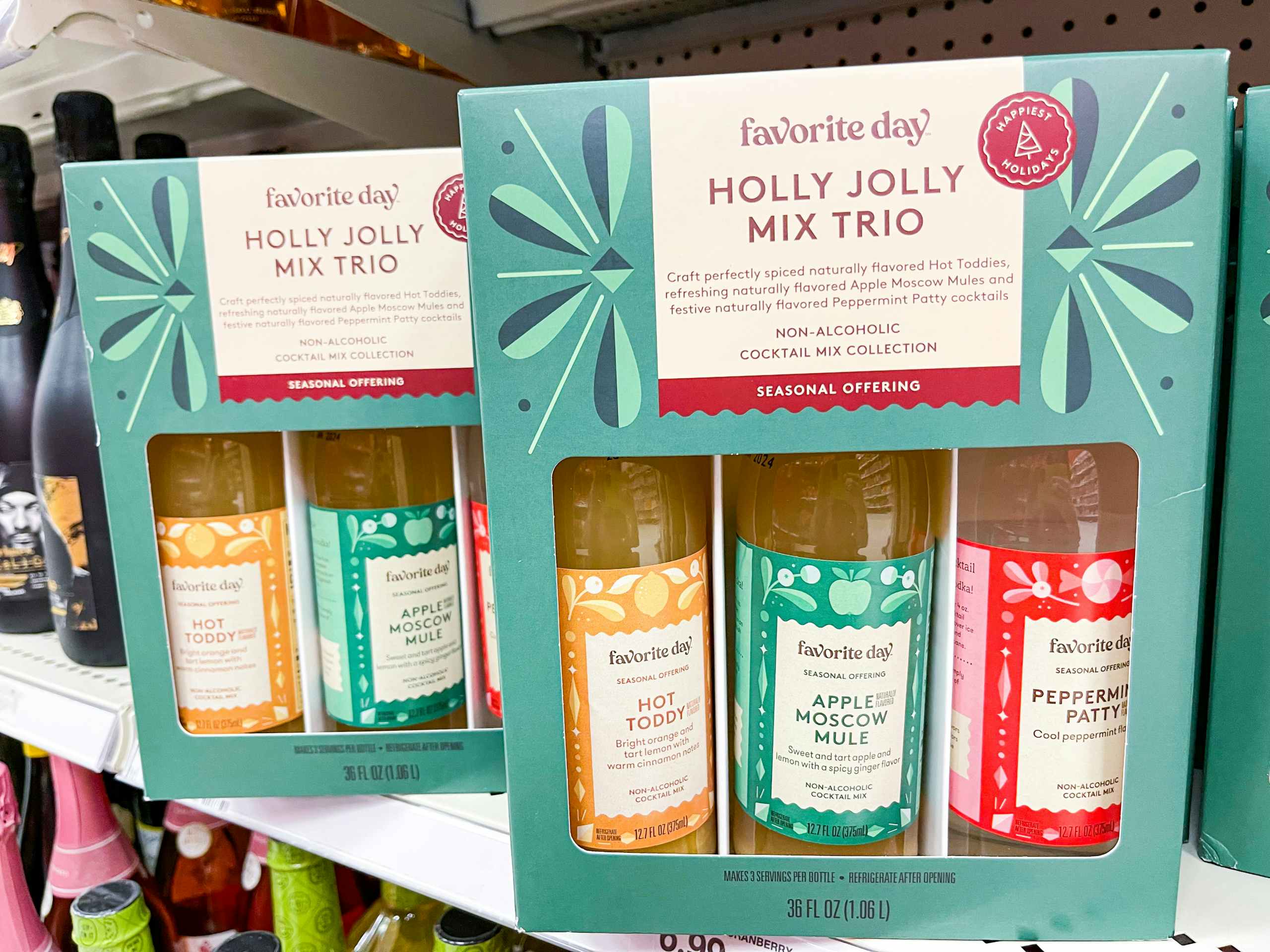 Two Holly Jolly Mix Trios Sitting on a store shelf.