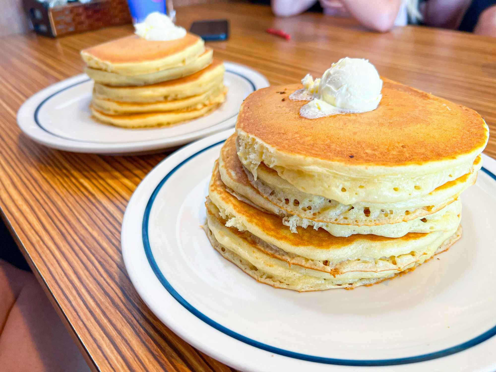 Plates of pancakes on a table at IHOP