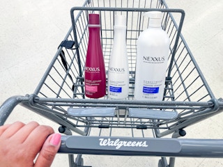 hand holding shopping cartnexxus hair caare in shopping cart