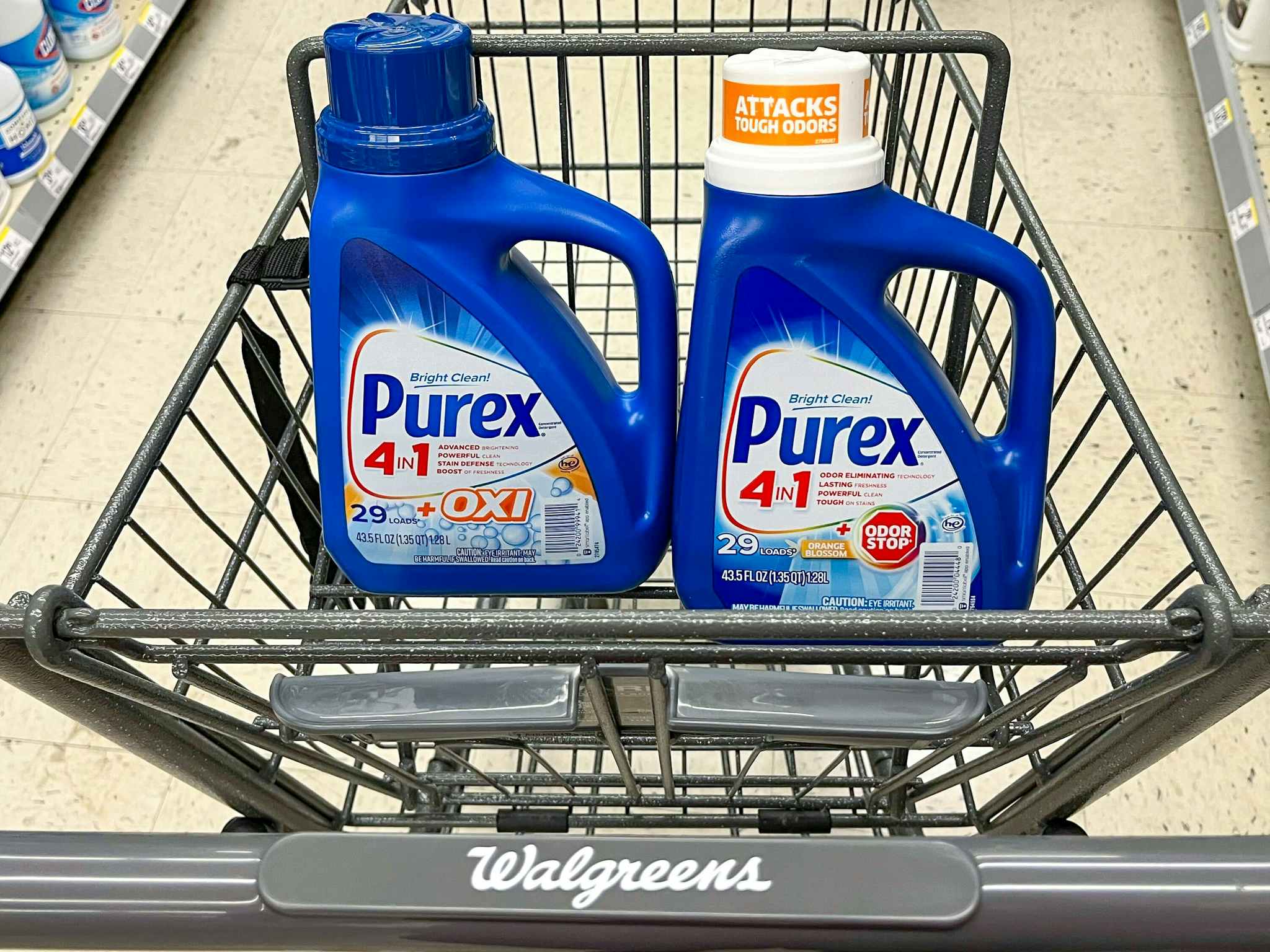 two bottle of purex detergent inside of shopping cart