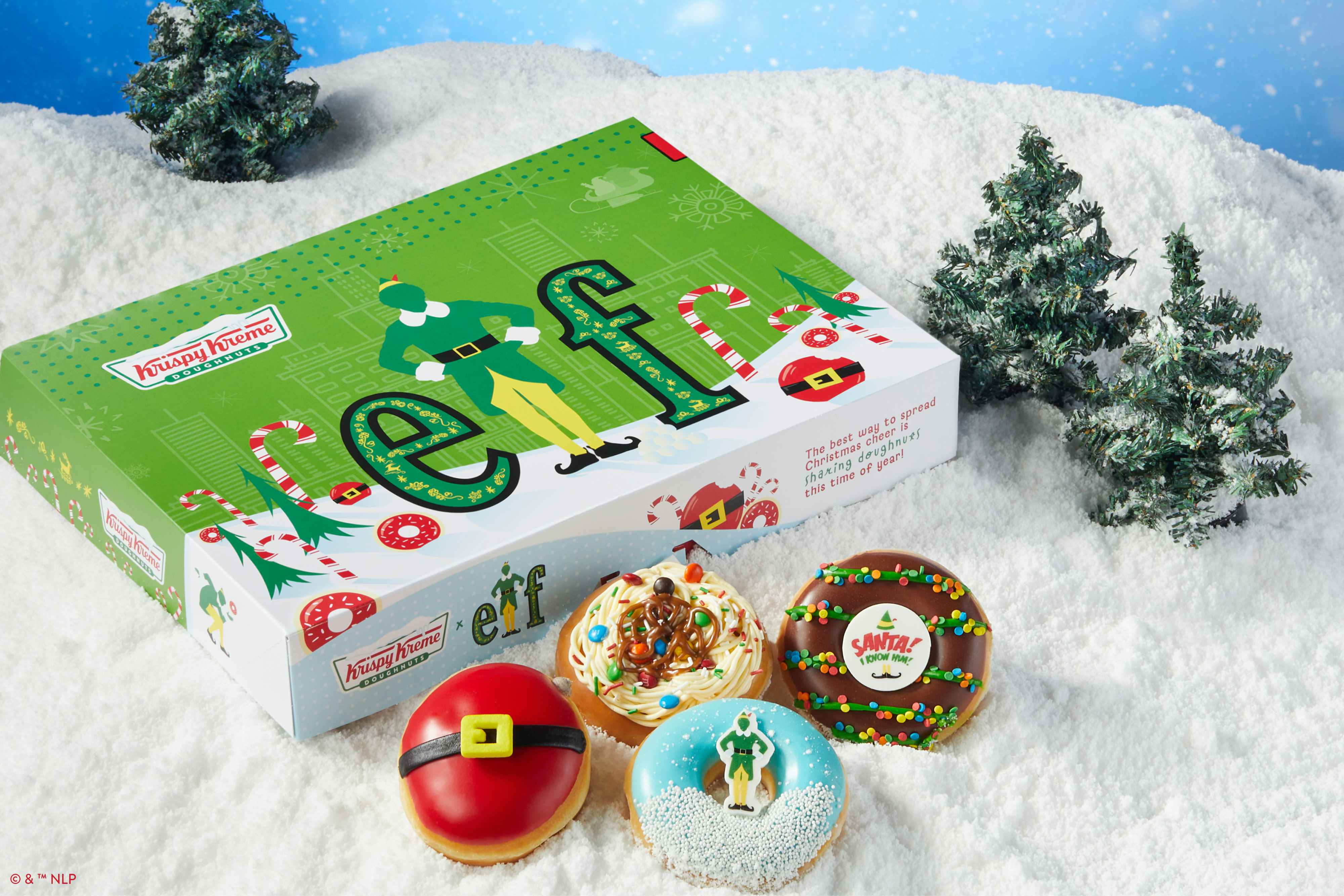The four Elf-inspired doughnuts next to the seasonal Krispy Kreme box.