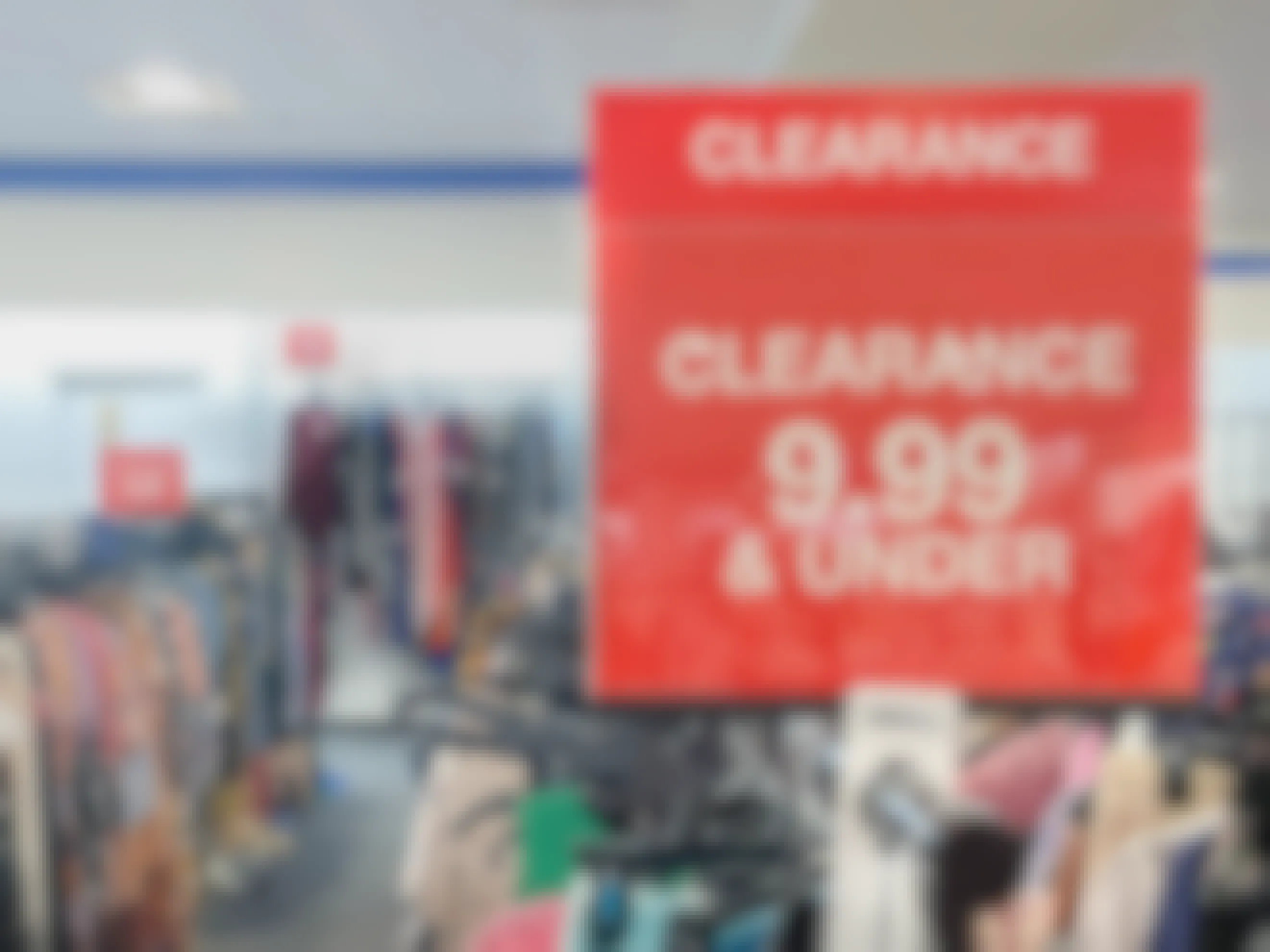 a clearance sign for $9.99 and under in front of a clearance rack at Macy's Backstage