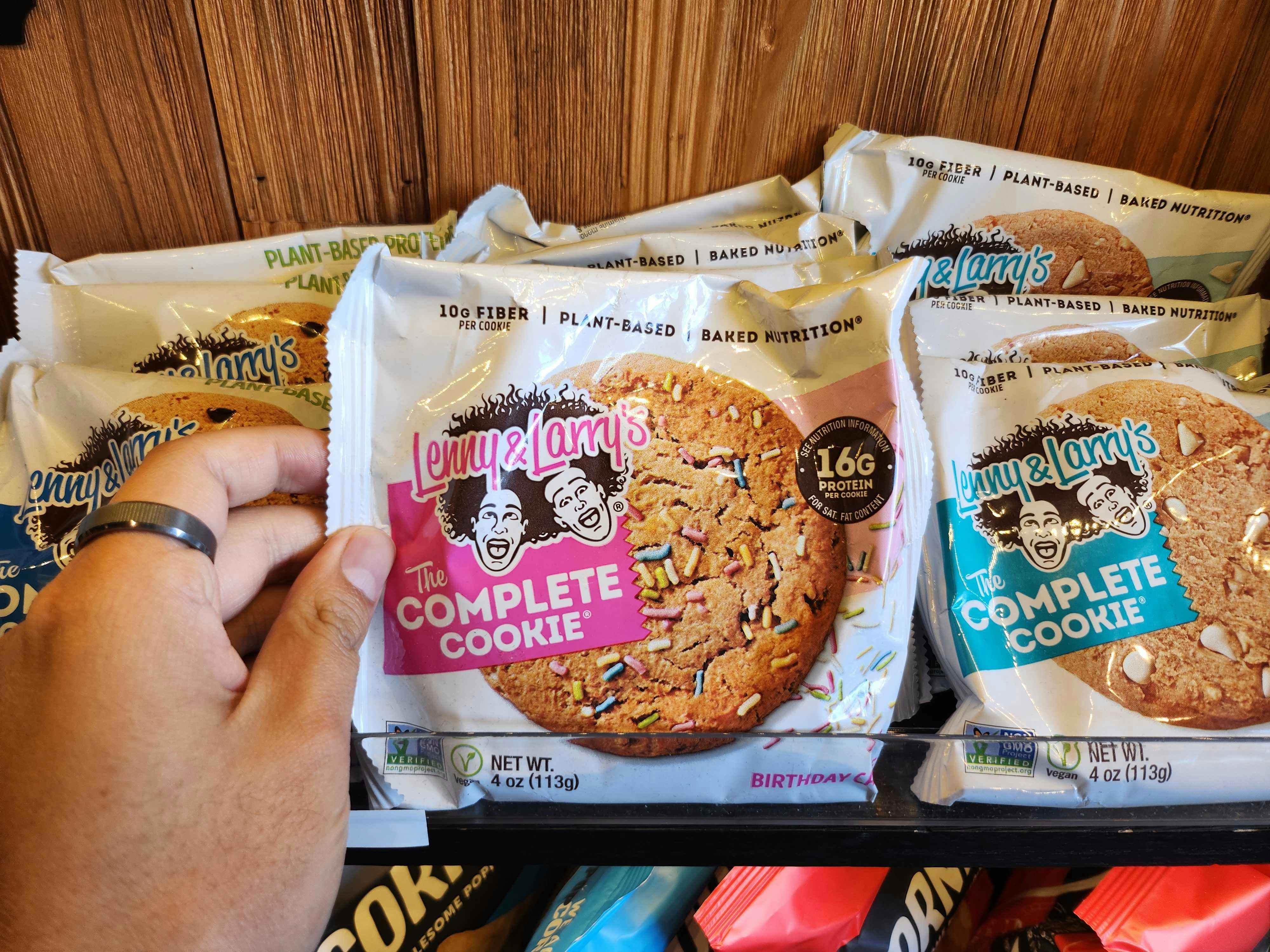 person holding lenny and larry cookies in front of other lenny and larry cookies