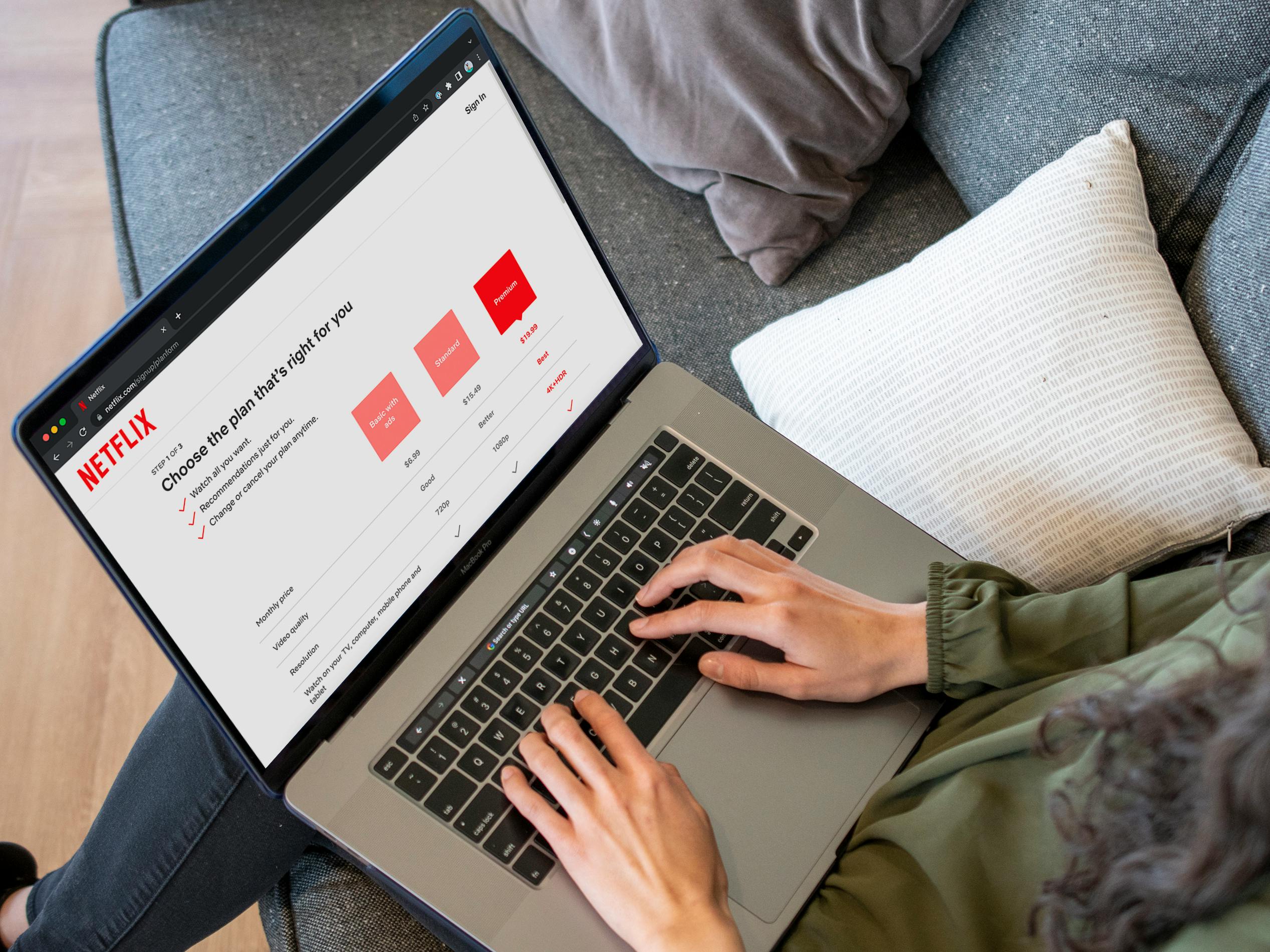 Someone looking at Netflix plan pricing on a laptop