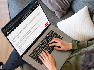 A person looking on Peloton's website, reading the page about their healthcare worker discount