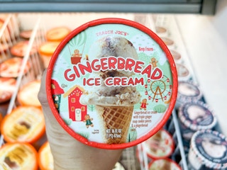 hand holding up Trader Joe's Gingerbread Ice Cream showing the top of the ice cream container in store