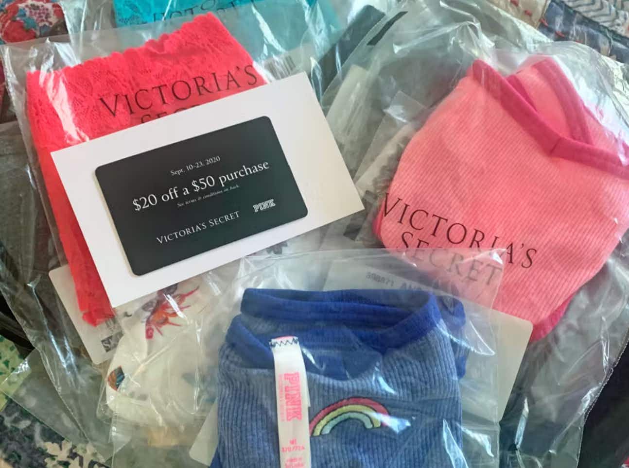 a bunch of victoria's secret online items in their shipping packaging