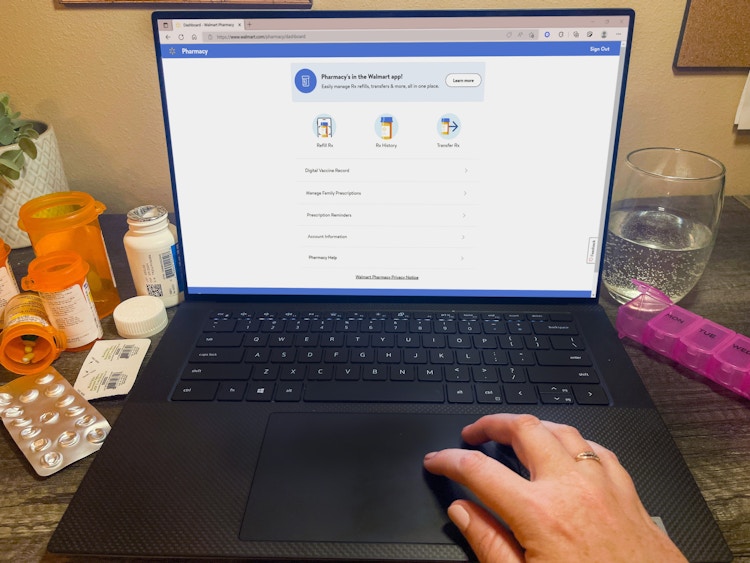 a person on a laptop looking at the walmart website 