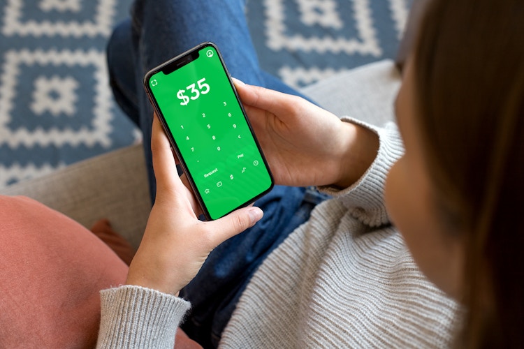 person using cash app on phone paying or requesting money
