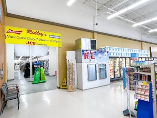 ridleys grocery store and ace hardware sign on store