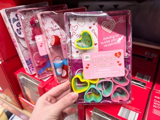 Someone holding a Heart Spring and card Valentine's Day kit at Aldi