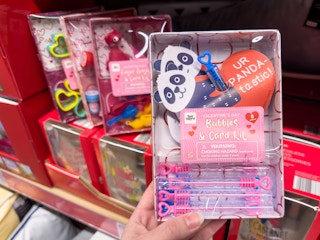 Someone holding a panda bubbles and card Valentine's Day kit at Aldi