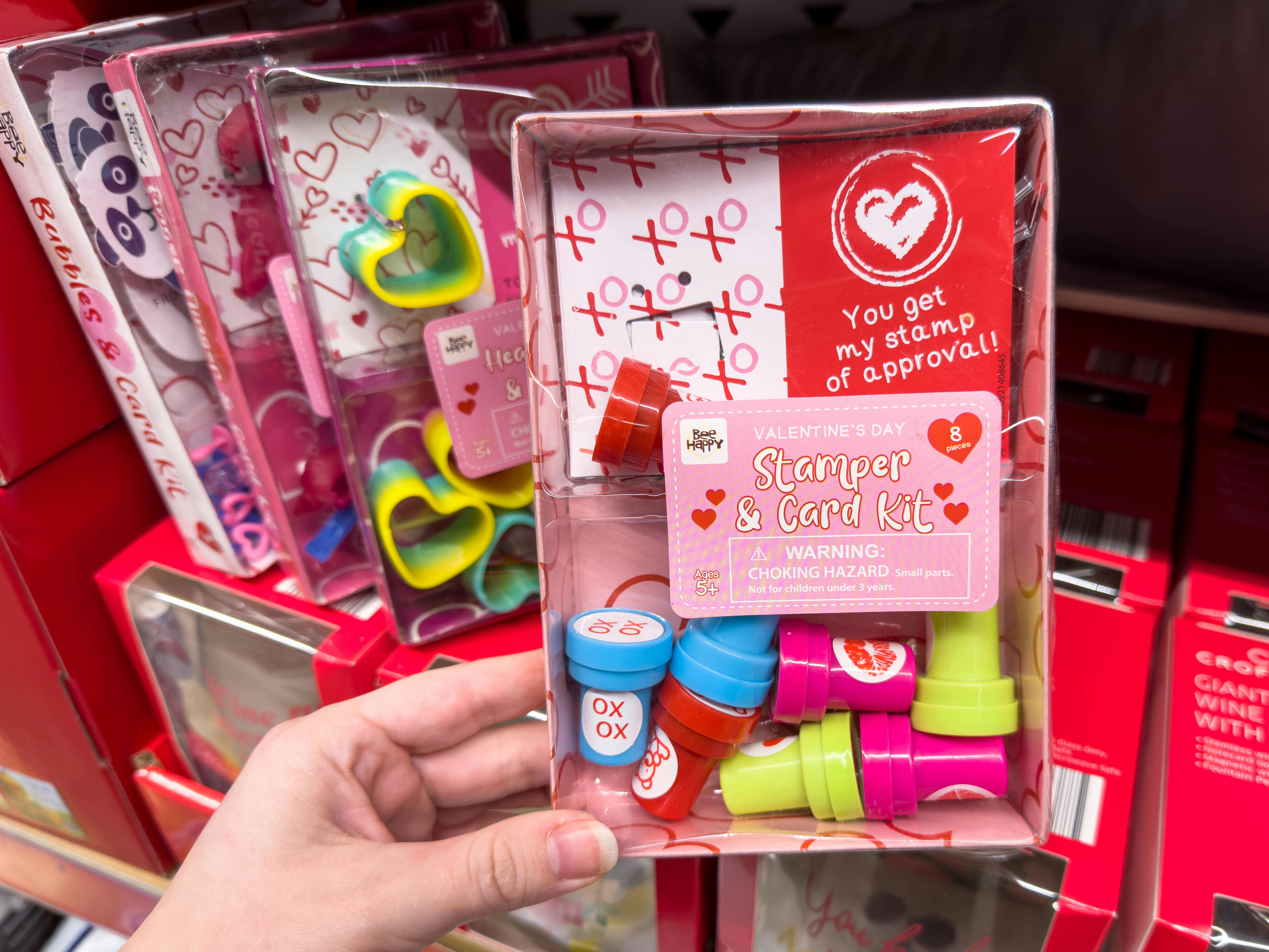 Someone holding a Stampers and card Valentine's Day kit at Aldi