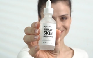 person holding zealsea hyaluronic acid serum