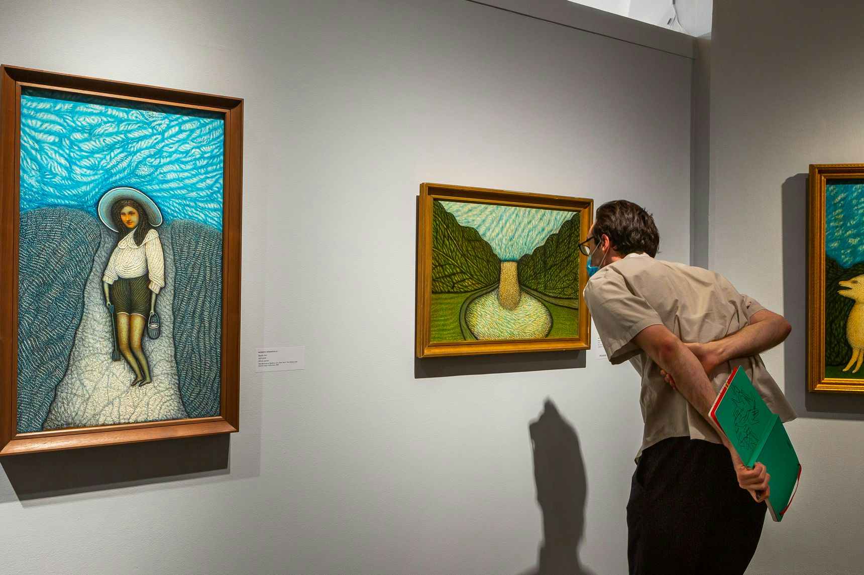 Person looking at art inside a museum