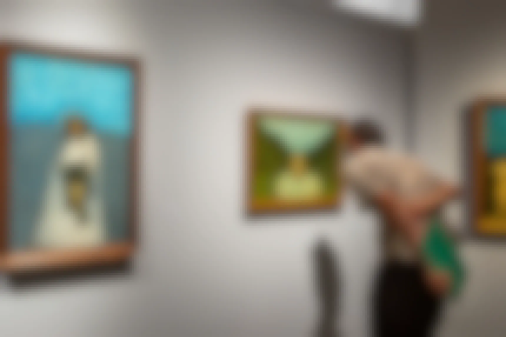 Person looking at art inside a museum
