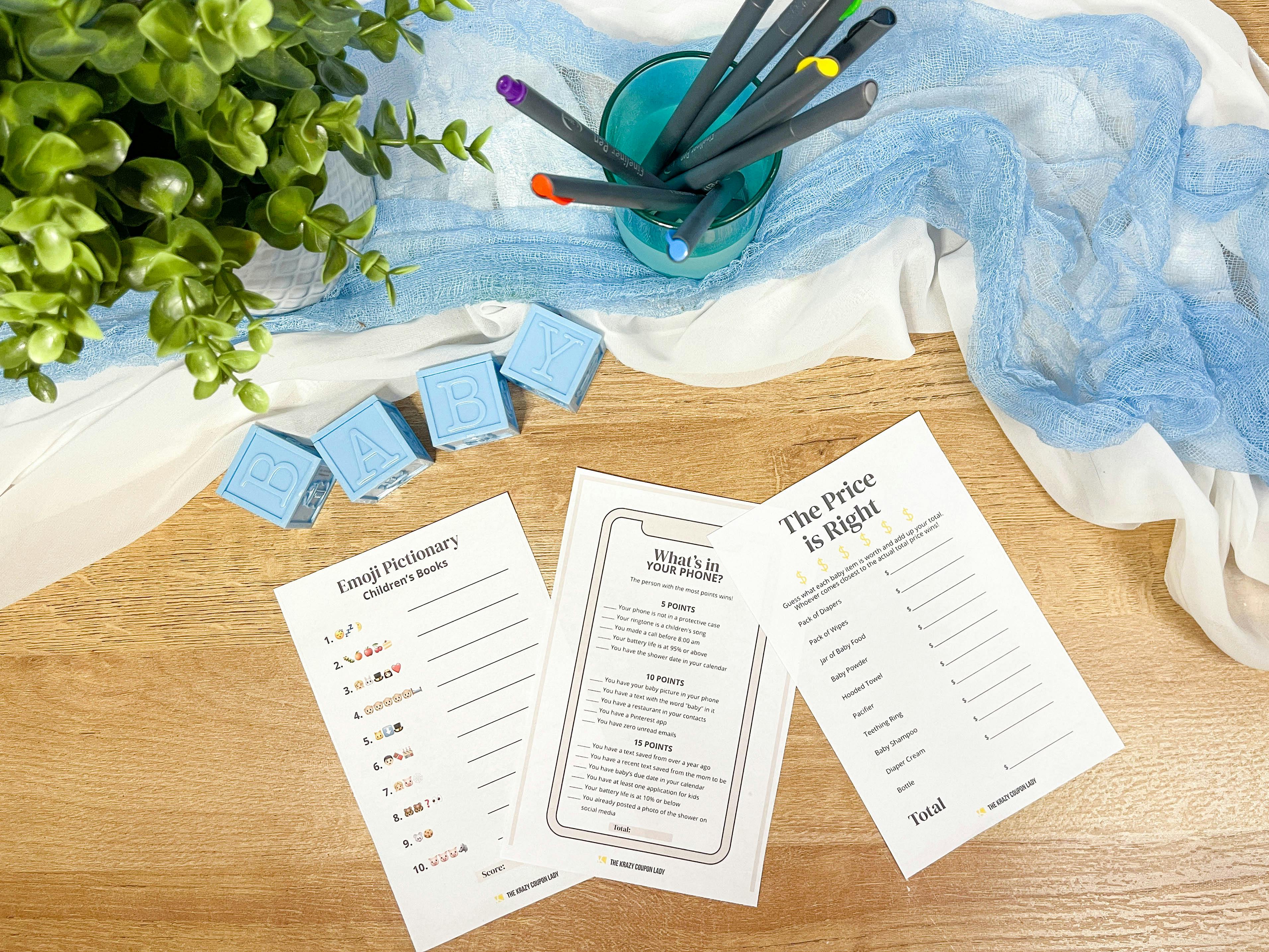 baby shower games printable cut out and sitting on a table with decor 