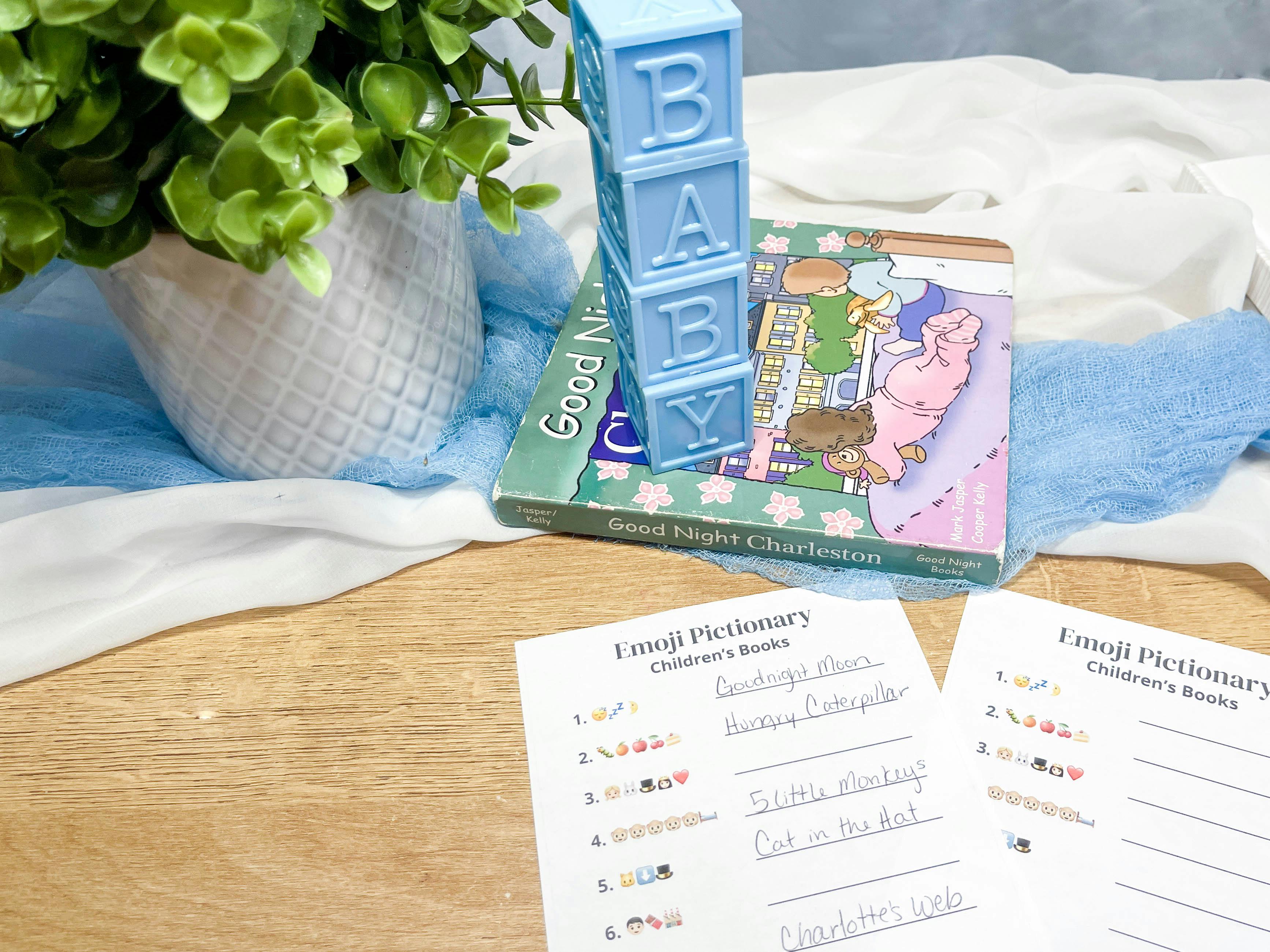 baby shower games printable that is cut out and sitting on a table with decor 