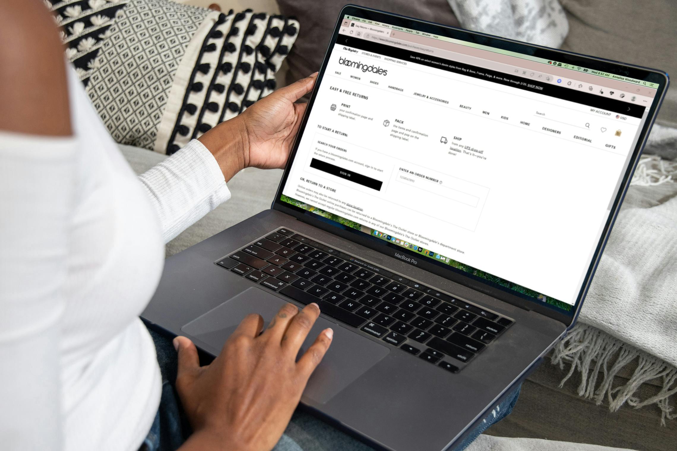 a person on a laptop on bloomingdales website