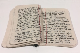 A journal made of fabric and thread created by Candace Hicks