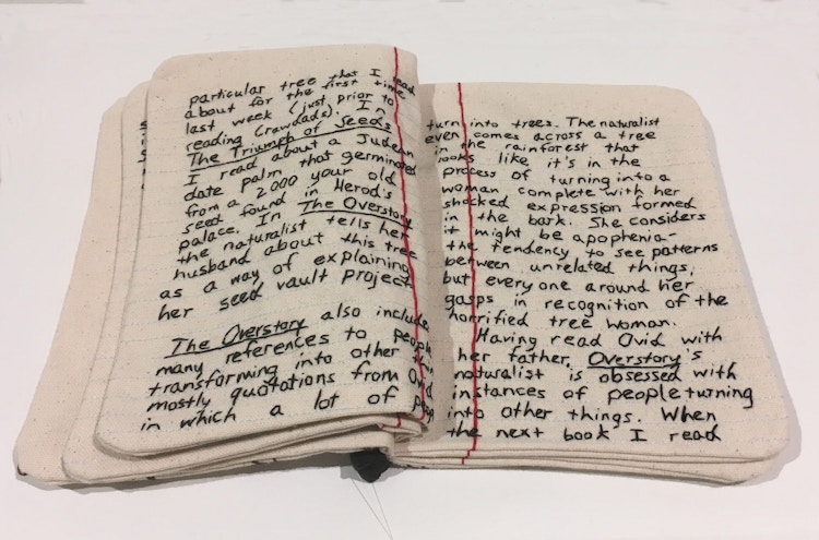 A journal made of fabric and thread created by Candace Hicks