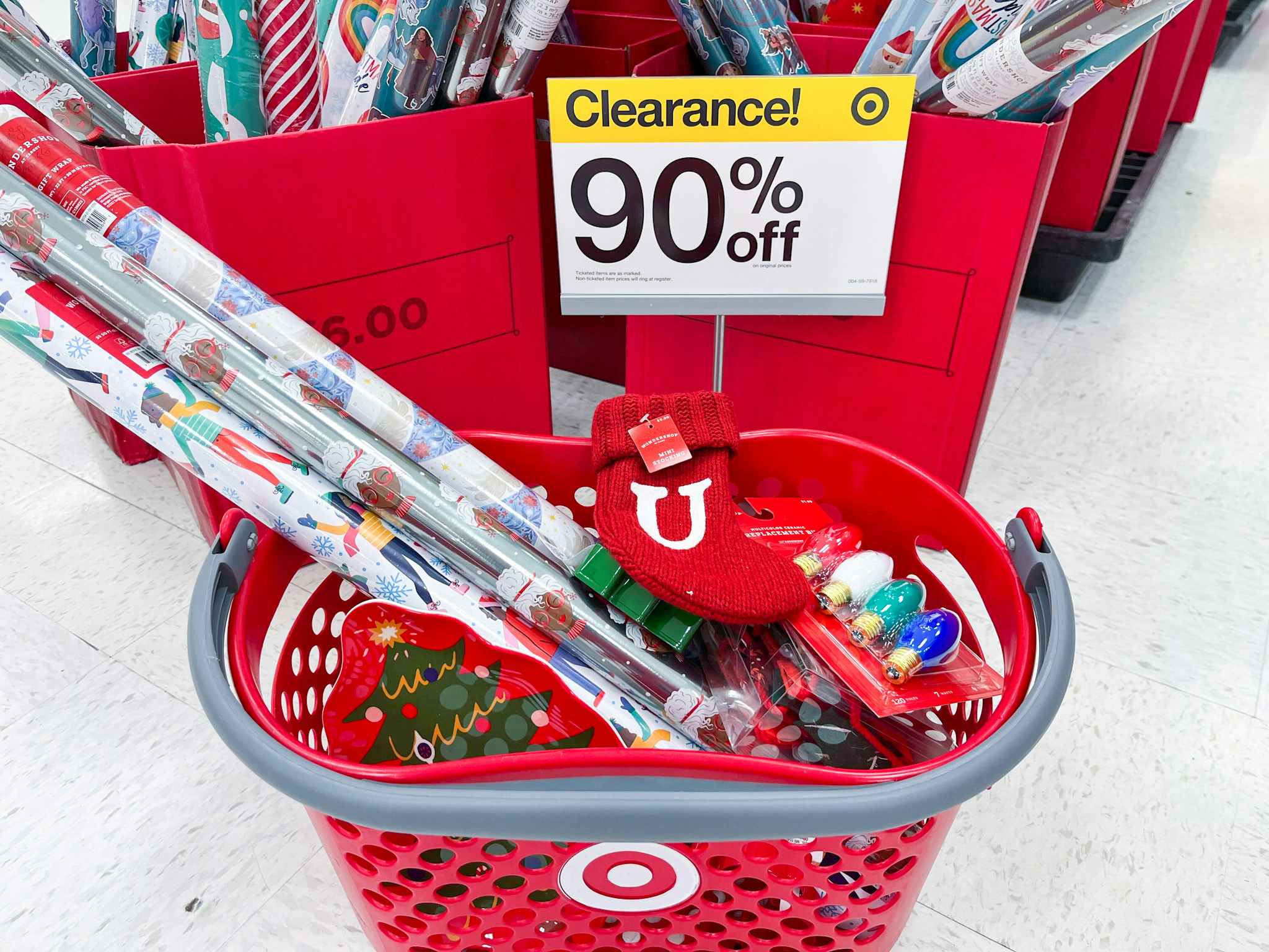 Shopping basket at Target next to a 90% off sign.