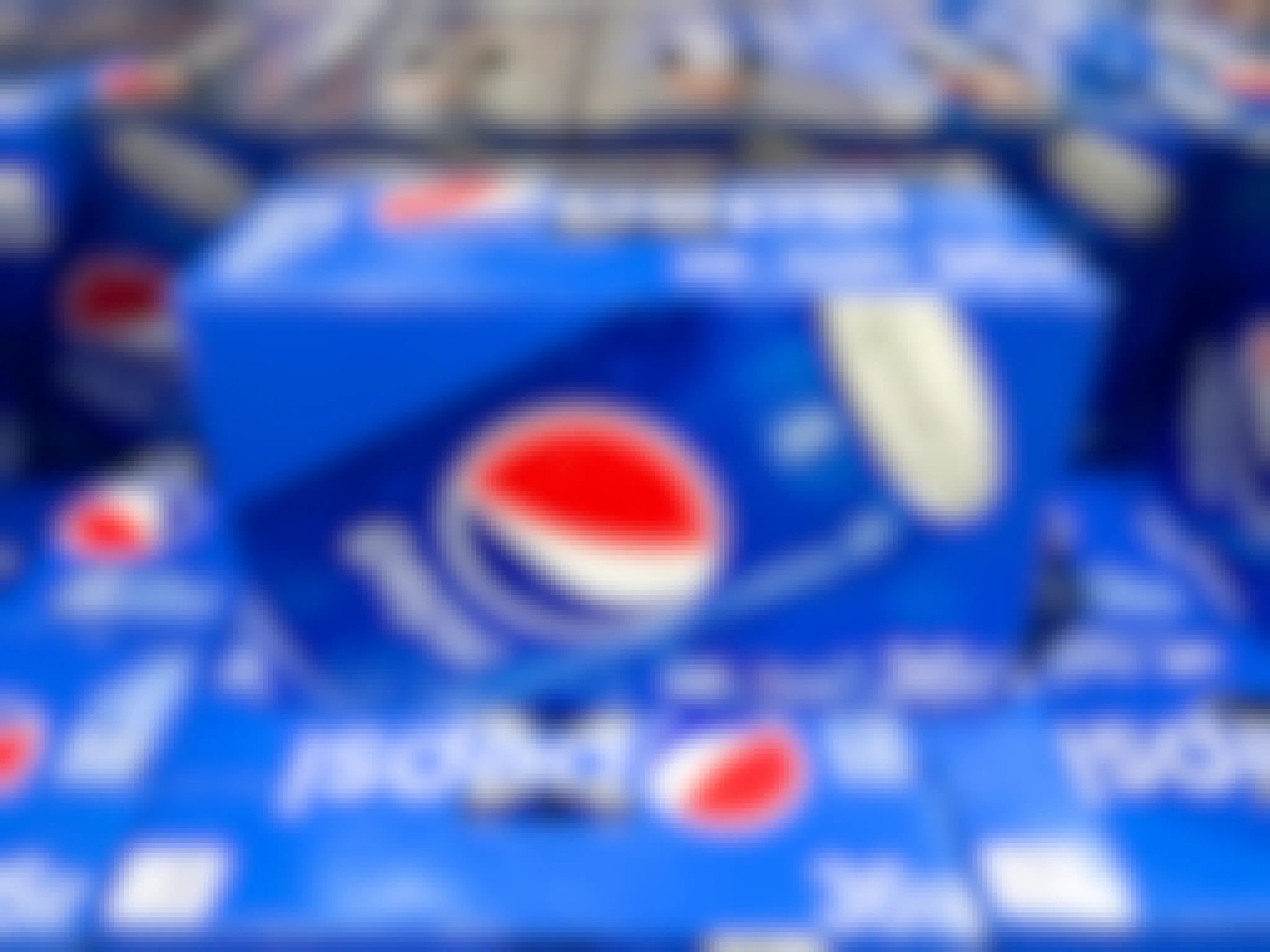 a box of pespi stacked on other boxes of pepsi