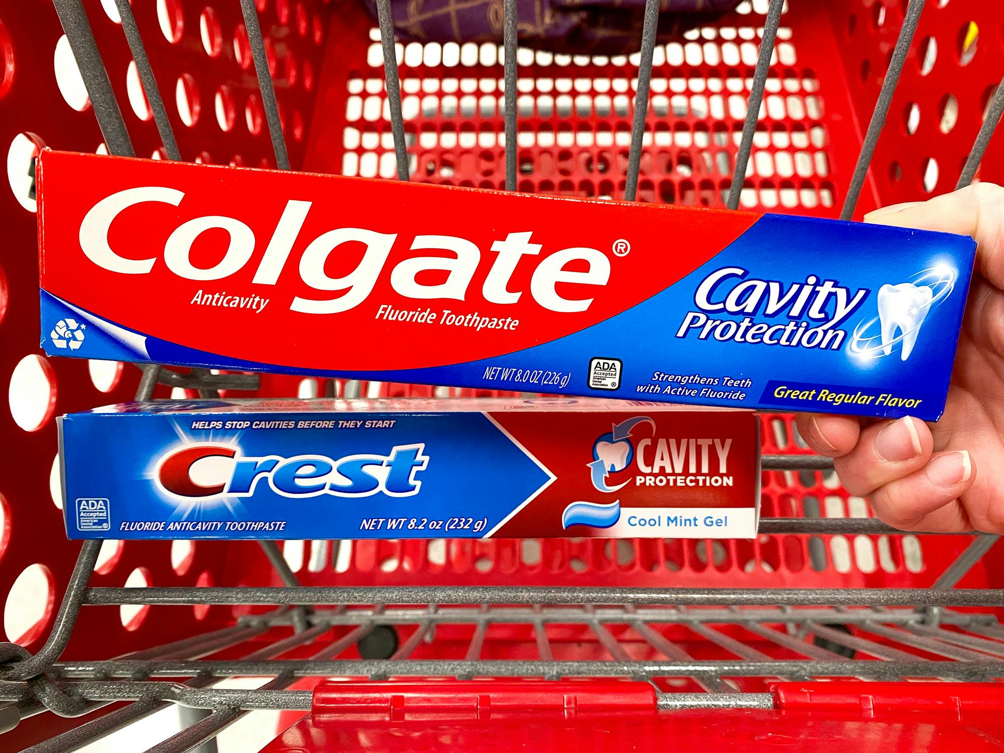 colgate and crest cavity protection toothpaste boxes in target cart