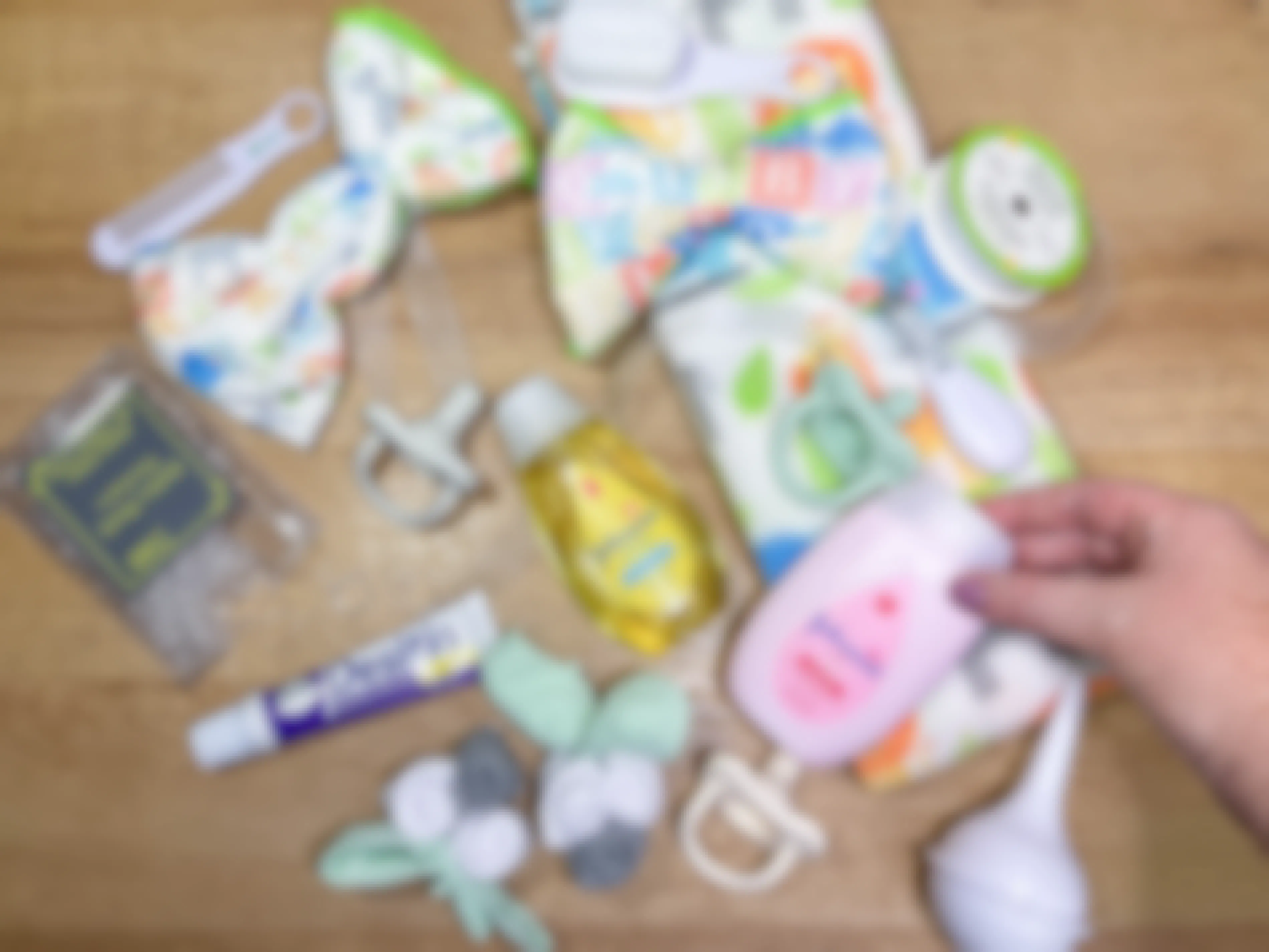 baby items on a table to make a diaper wreath