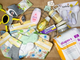 baby items on a table to make a diaper wreath