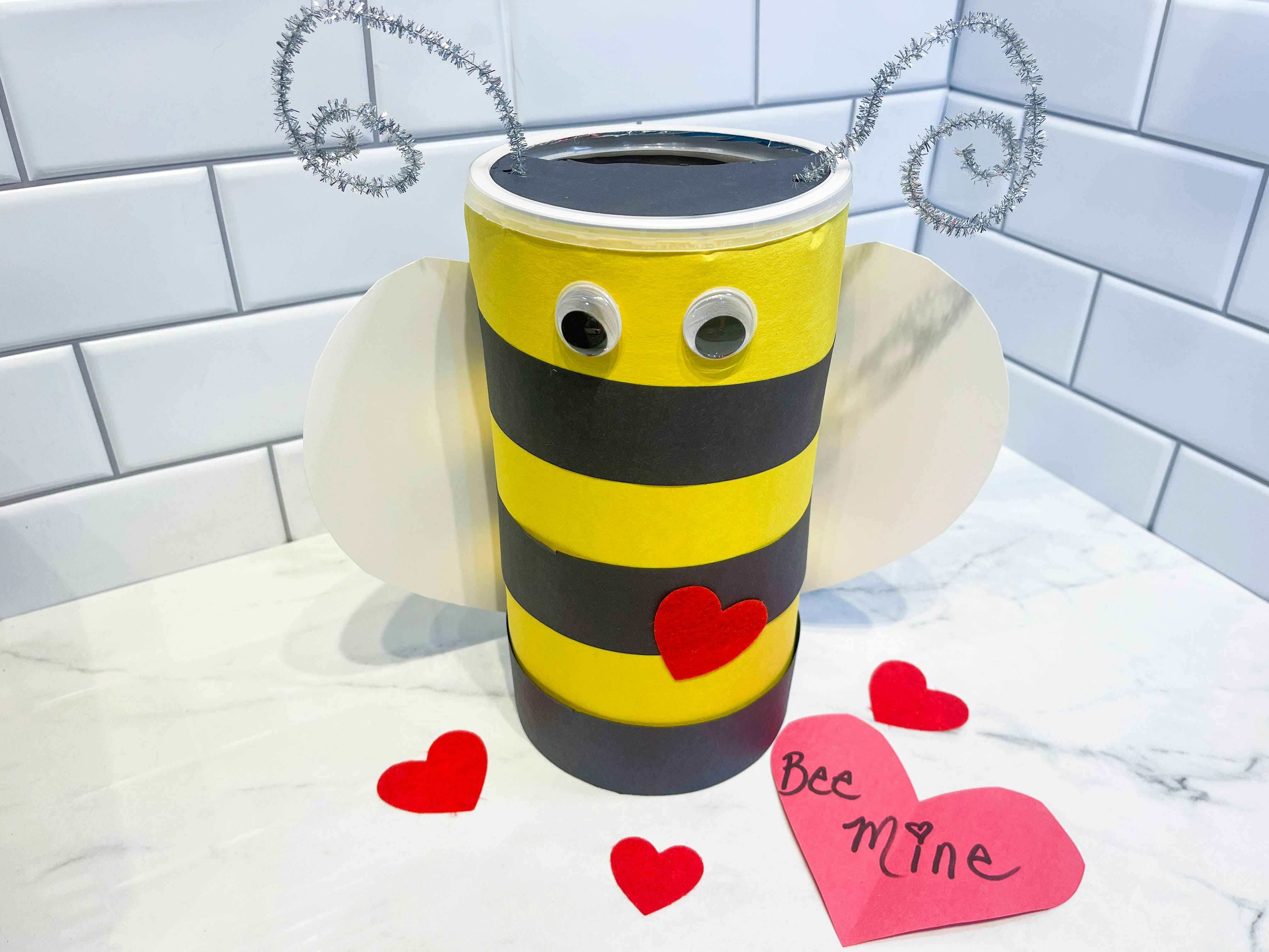 a diy bee valentine sitting on a counter 