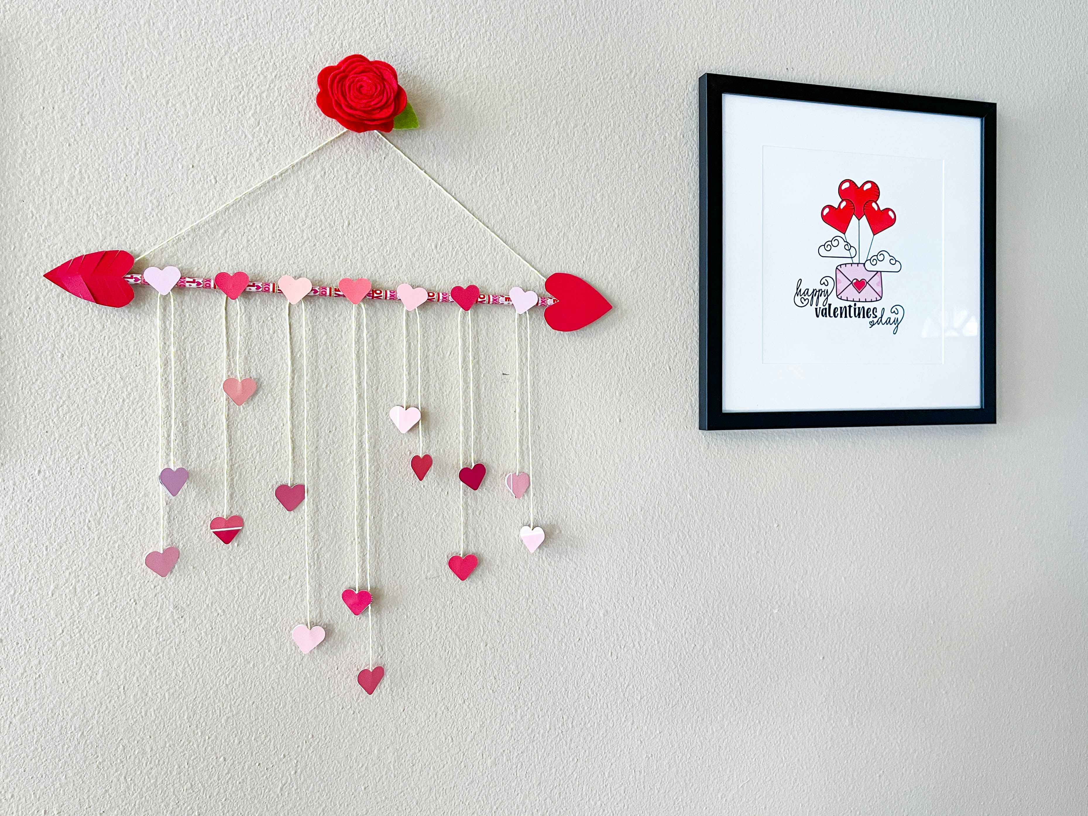 a heart wreath made from heart cut outs and pencils 