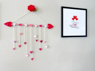 a heart wreath made from heart cut outs and pencils