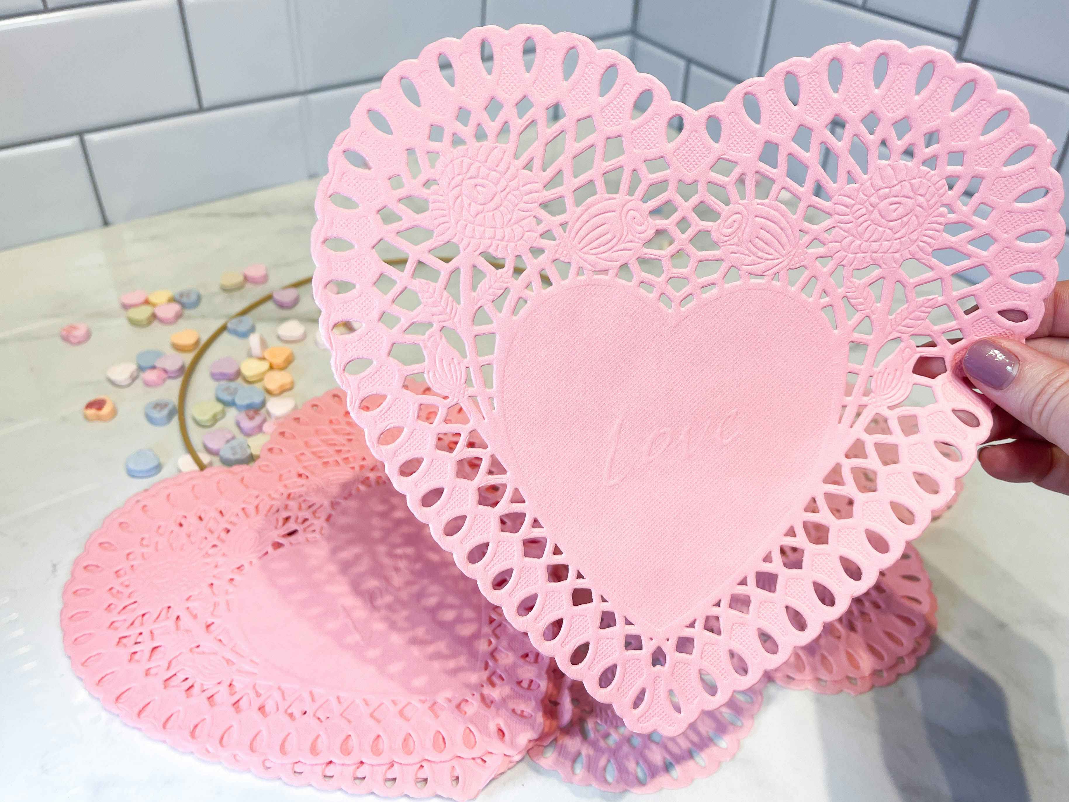 a heart paper doilies on a counter 
