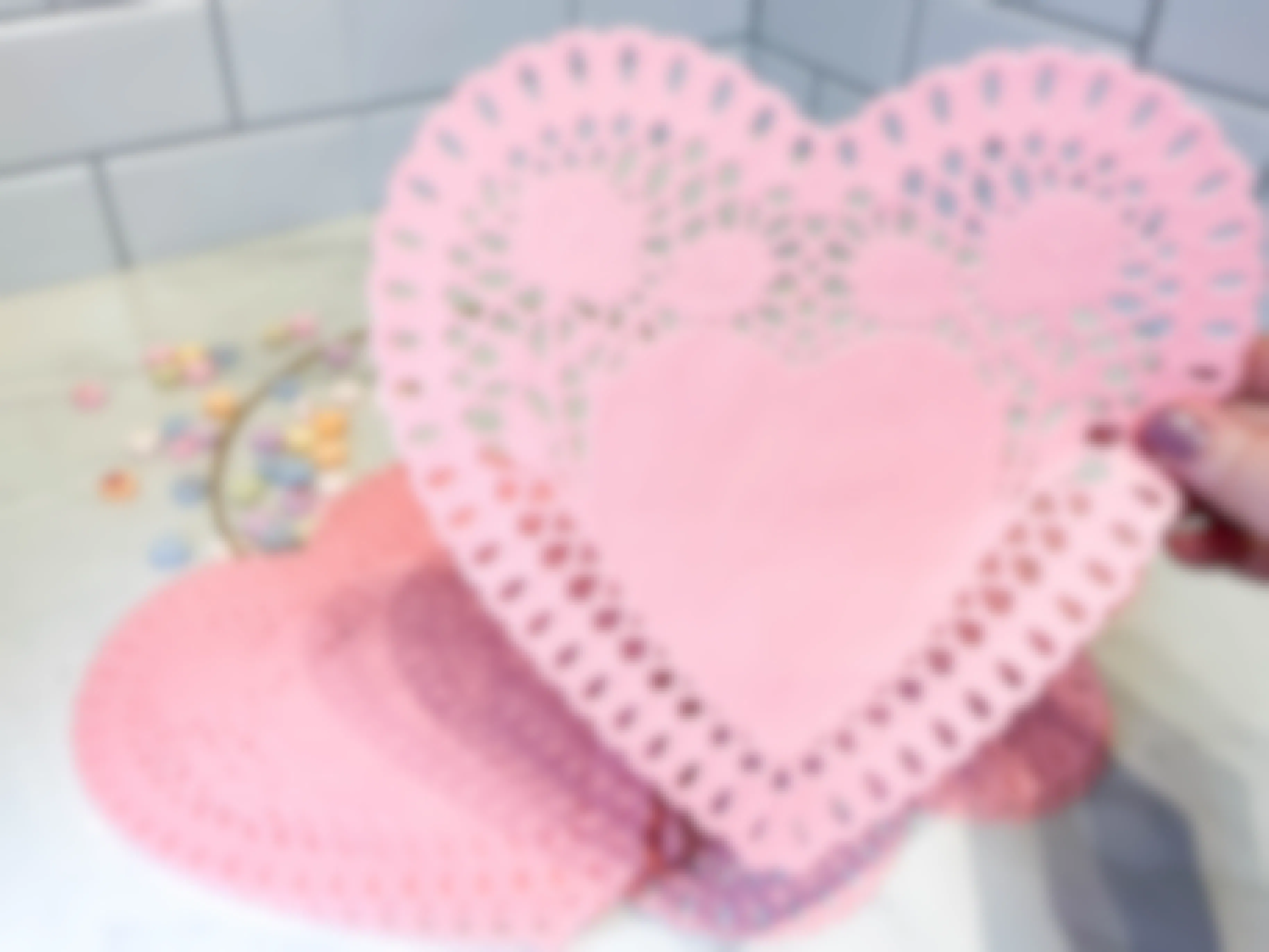 a heart paper doilies on a counter 