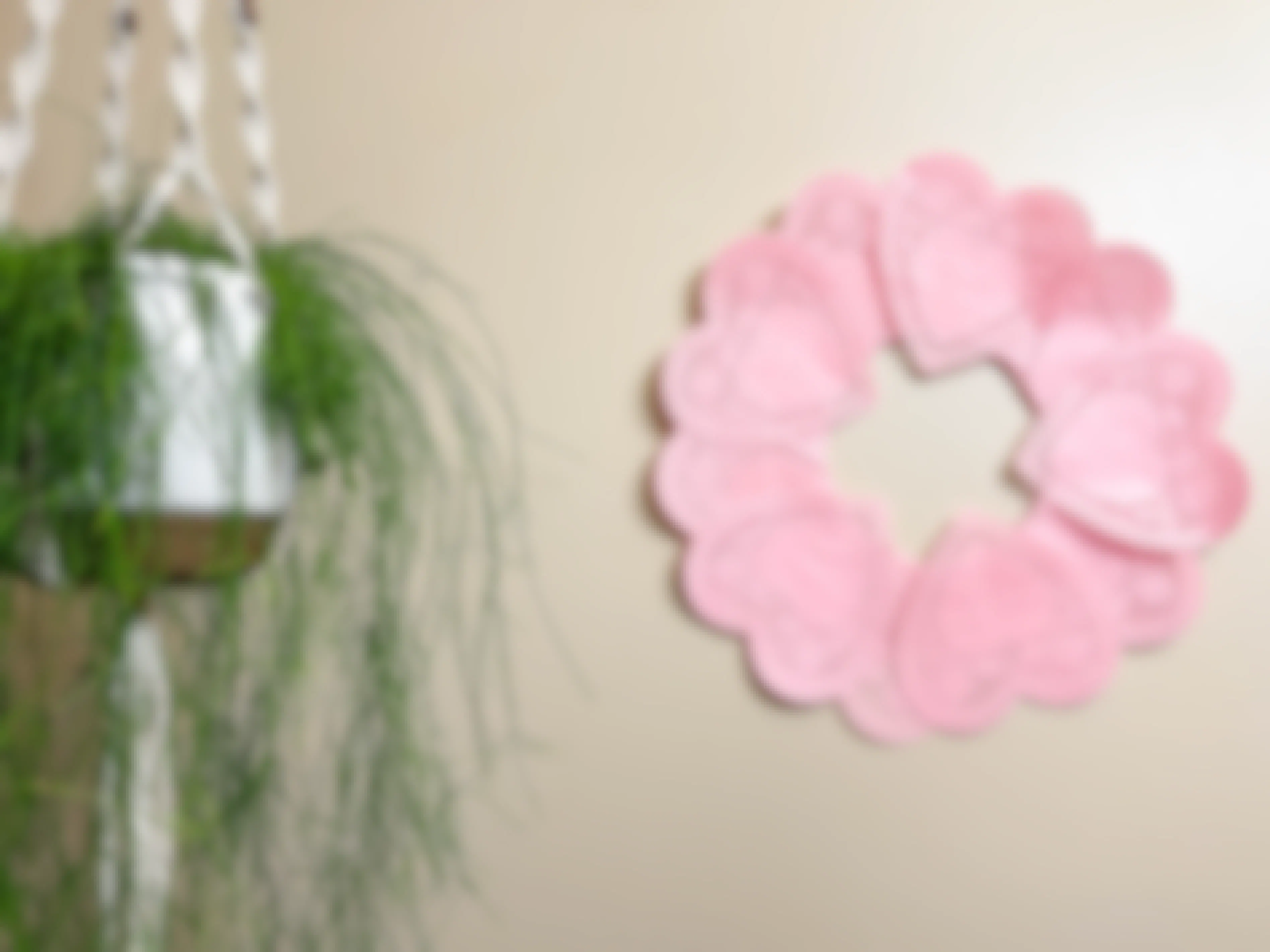 a heart paper doilies wreath on a wall 