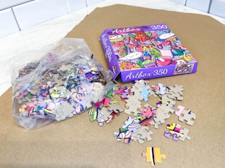 a puzzle on a cardboard sheet