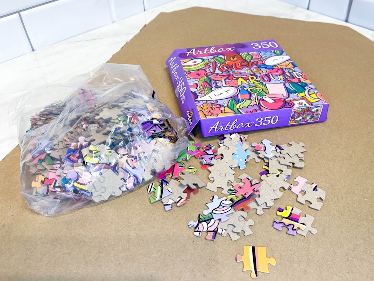 a puzzle on a cardboard sheet 